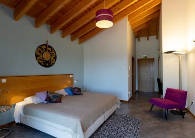 Quarto da agua bedroom with beamed ceiling